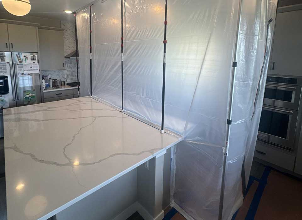 About BORLakewood - Kitchen Containment Kitchen sealed with plastic dust containment barrier
