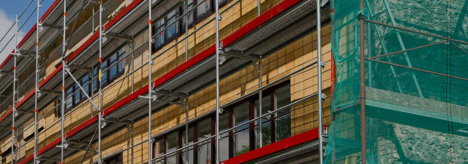Building facade with scaffolding and netting