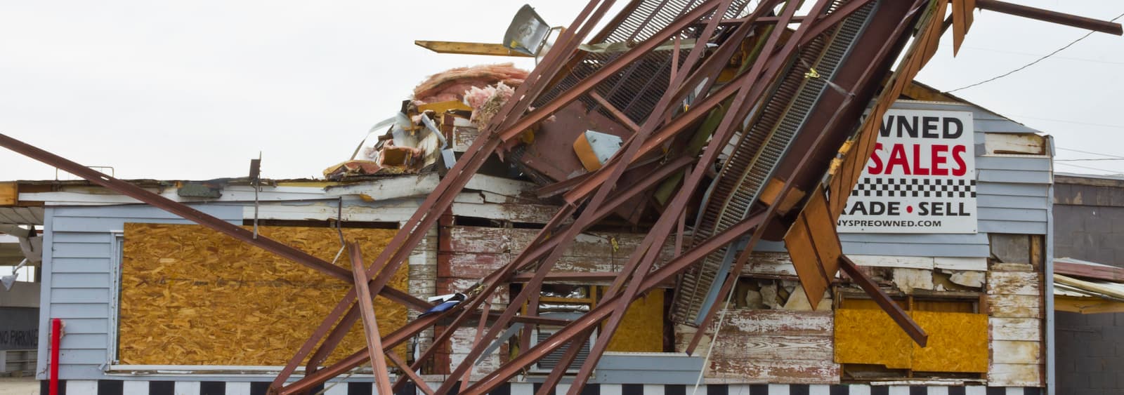 Damaged building with debris and clutter.