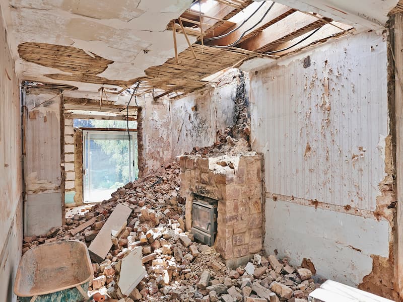 Property Damage Cleanup in Lakewood image 004 Demolished room with exposed brickwork.